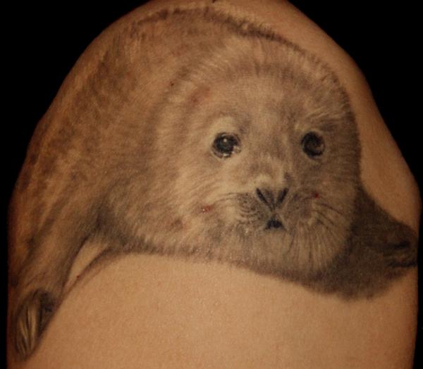 Tattoo by Petri Syrjälä. When Harp Seal pups are born, they have beautiful 
